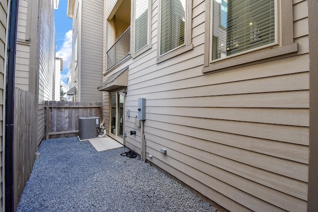 view of side of property featuring central air condition unit