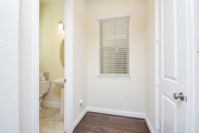 bathroom featuring toilet and hardwood / wood-style flooring