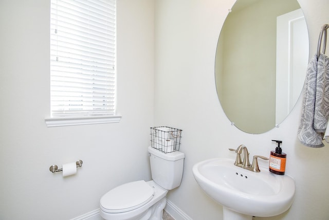 bathroom with toilet and sink