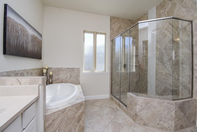 bathroom featuring vanity and separate shower and tub