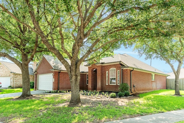 ranch-style house with a garage and a front yard