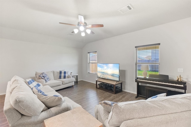 living room with vaulted ceiling, dark wood-type flooring, and ceiling fan