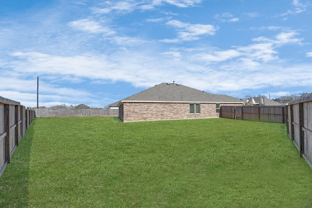 view of yard featuring a fenced backyard