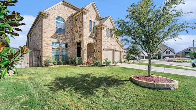 view of front of home featuring a garage and a front yard