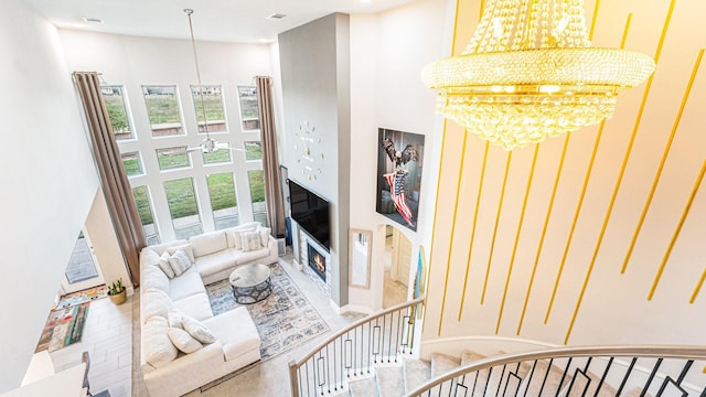 living room with a high ceiling and a chandelier