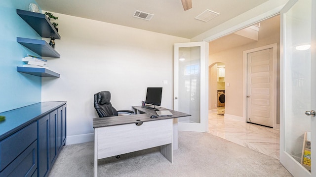 office featuring washer / dryer and ceiling fan