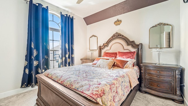 bedroom featuring vaulted ceiling, ceiling fan, and carpet flooring