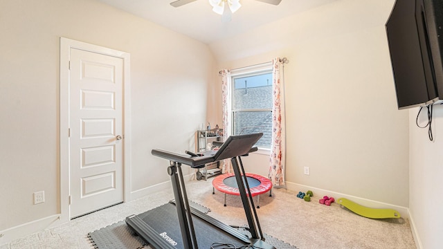 workout area with ceiling fan, carpet, and lofted ceiling