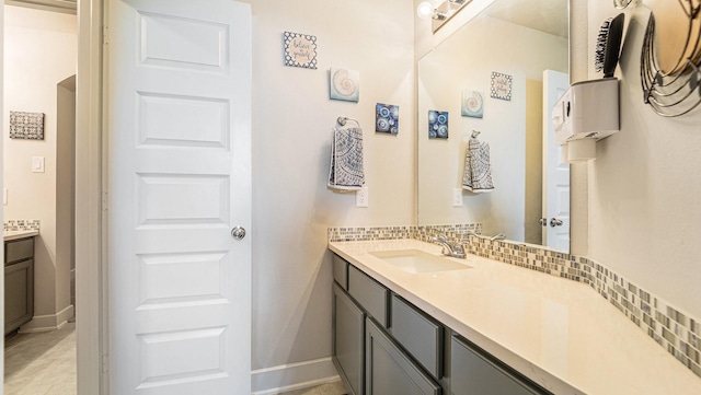 bathroom featuring decorative backsplash and vanity