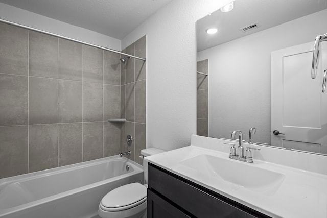 26240 Astral Way, La Marque, TX 77568 - bathroom with toilet, vanity, shower / bathtub combination, and a textured wall