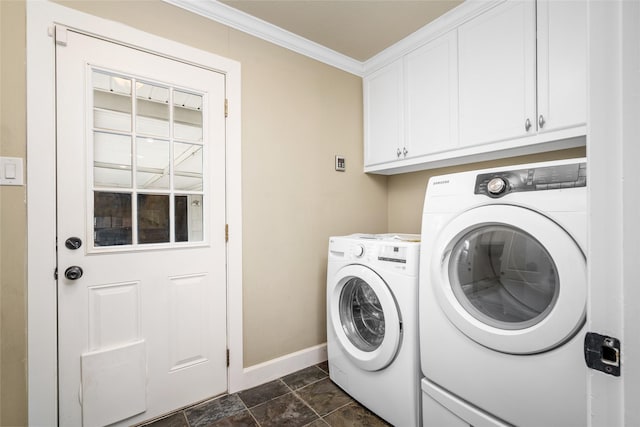 laundry area featuring cabinets, ornamental molding, and washing machine and clothes dryer