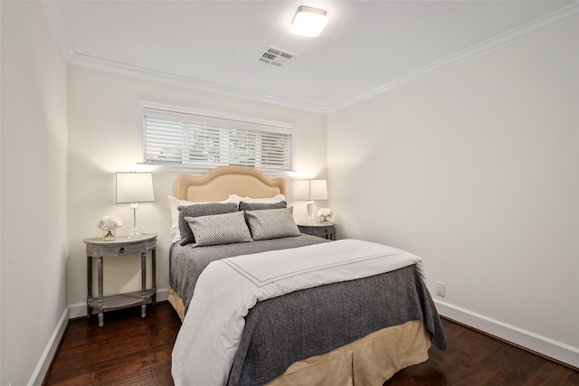 bedroom featuring crown molding and dark wood-type flooring