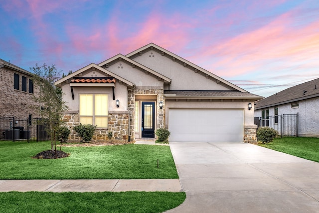 view of front facade featuring a yard and a garage