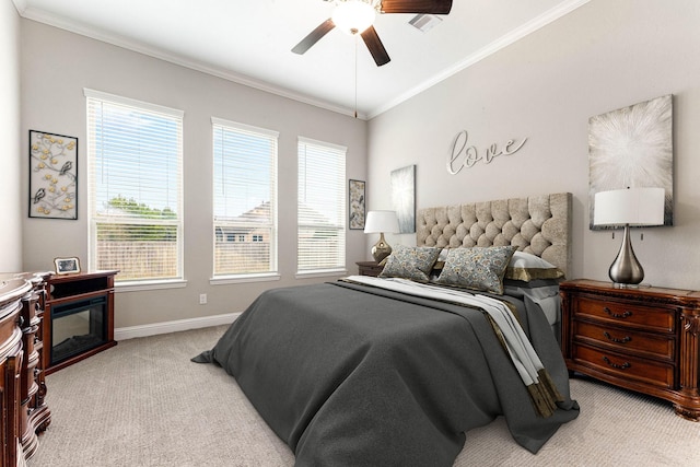 carpeted bedroom featuring ceiling fan, ornamental molding, and multiple windows