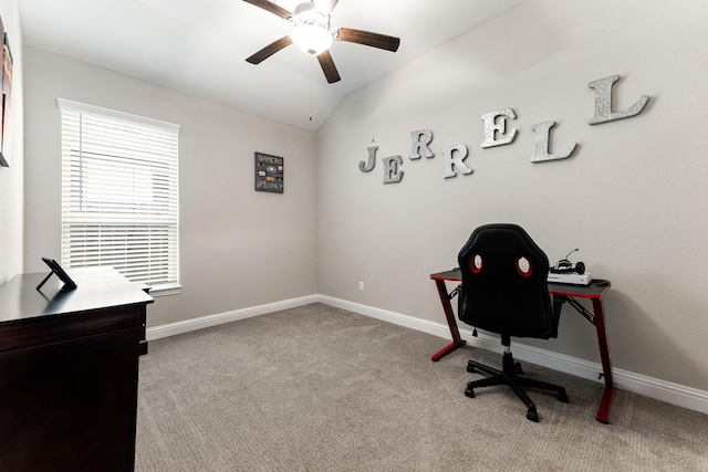 carpeted office featuring lofted ceiling and ceiling fan