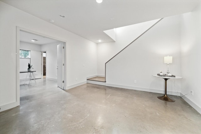 interior space featuring a skylight and concrete flooring