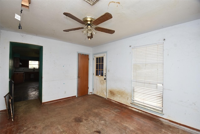 unfurnished room featuring ceiling fan