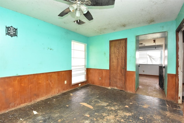 empty room with wooden walls