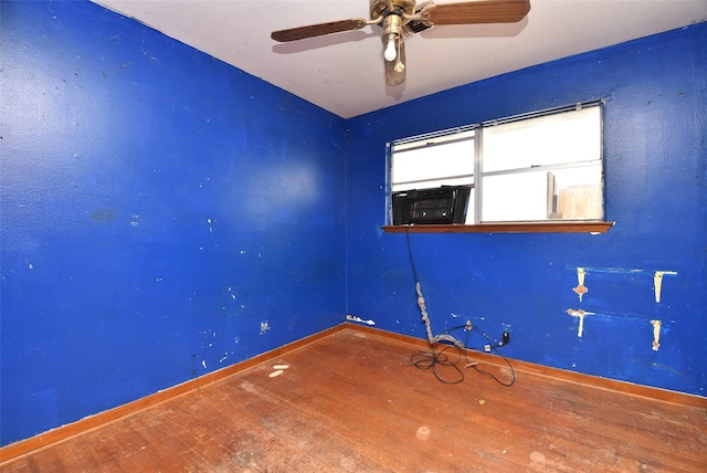 spare room with hardwood / wood-style floors and ceiling fan