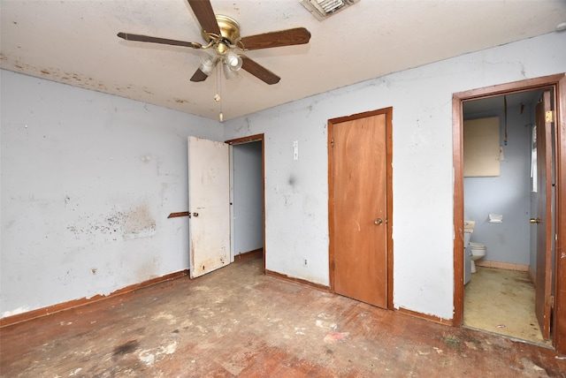 unfurnished bedroom with ceiling fan and ensuite bathroom