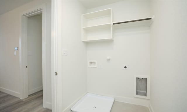 laundry room featuring hookup for a gas dryer, hardwood / wood-style floors, hookup for a washing machine, and hookup for an electric dryer