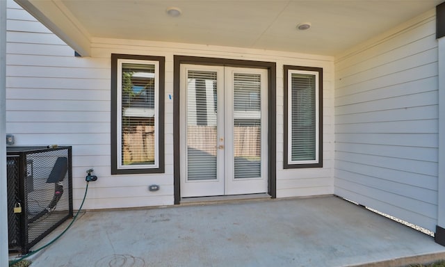 doorway to property featuring a patio area and french doors