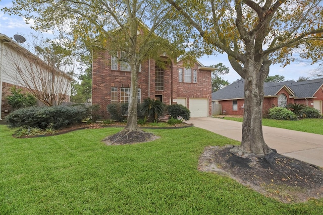 view of property with a garage and a front yard