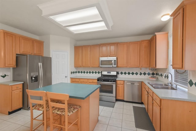 kitchen with sink, backsplash, light tile patterned floors, and stainless steel appliances