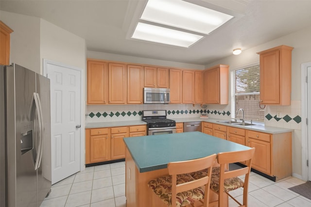 kitchen featuring appliances with stainless steel finishes, light brown cabinetry, sink, backsplash, and light tile patterned flooring