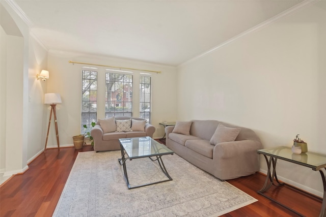 living room with crown molding and hardwood / wood-style flooring