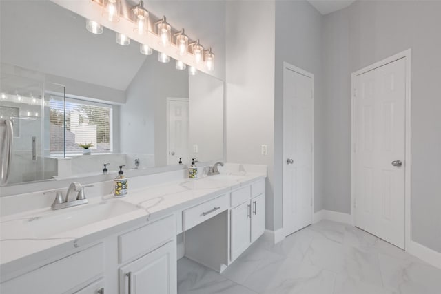 bathroom with vanity and a shower with shower door