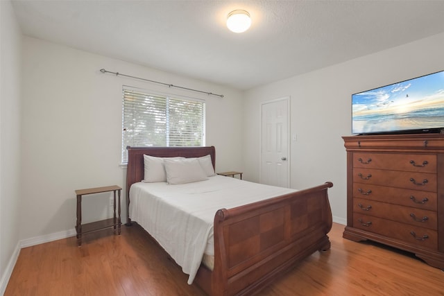 bedroom with hardwood / wood-style floors