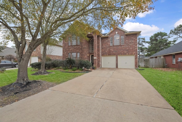 front of property featuring a garage and a front lawn