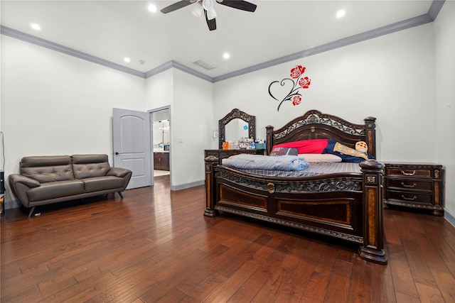 bedroom with dark wood-type flooring, ceiling fan, ornamental molding, and connected bathroom