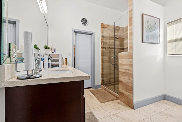 bathroom featuring vanity, tile patterned flooring, and a shower with door