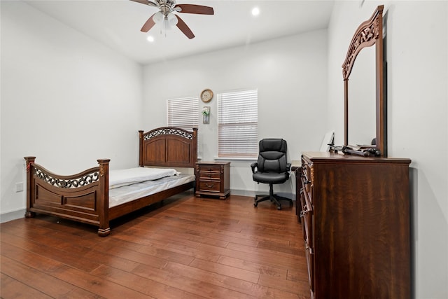 bedroom featuring ceiling fan and dark hardwood / wood-style floors