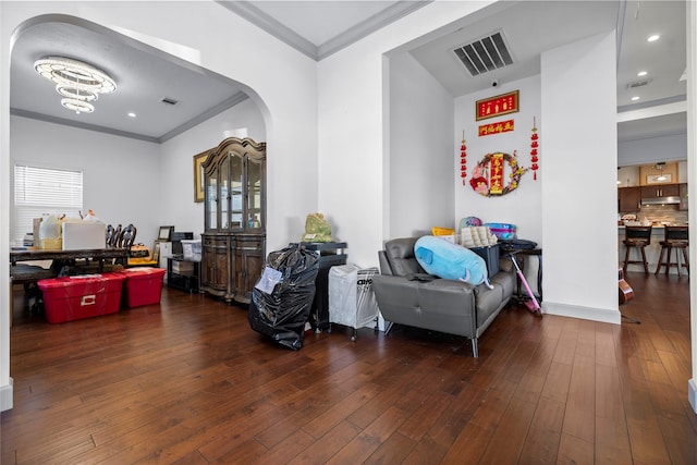 interior space featuring dark wood-type flooring and ornamental molding