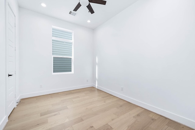 spare room featuring light hardwood / wood-style floors and ceiling fan