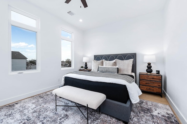 bedroom featuring ceiling fan and hardwood / wood-style flooring