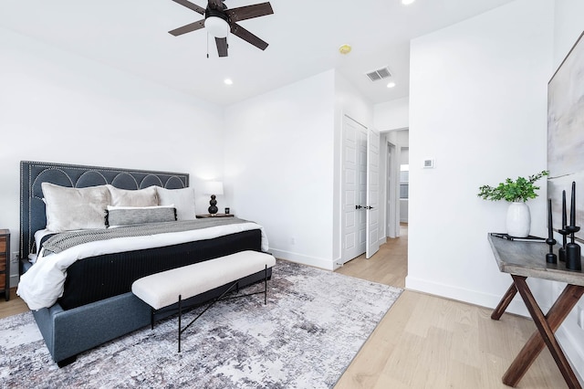 bedroom featuring hardwood / wood-style flooring and ceiling fan