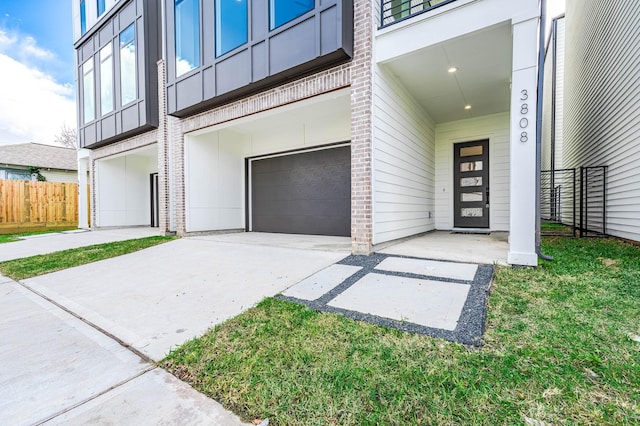 view of exterior entry featuring a garage