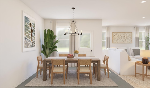 dining room featuring a chandelier, recessed lighting, and baseboards