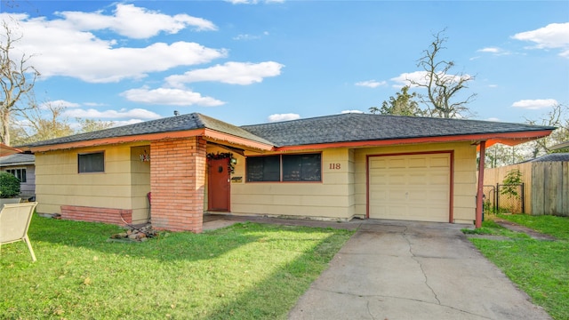 single story home with a front lawn and a garage