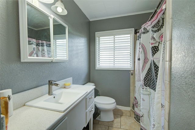 bathroom with toilet, vanity, tile patterned floors, ornamental molding, and curtained shower