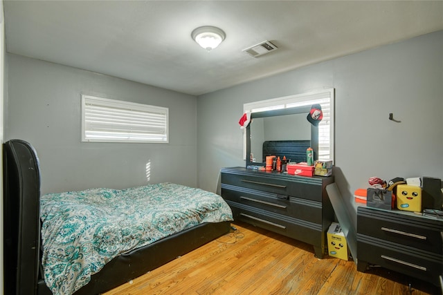 bedroom with hardwood / wood-style floors