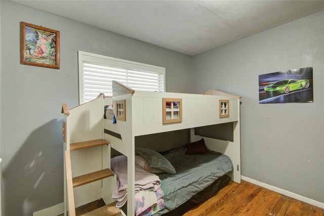 bedroom featuring dark wood-type flooring