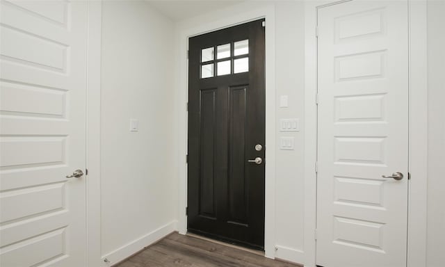 foyer entrance with dark hardwood / wood-style flooring