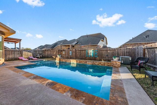 view of pool featuring a patio and a jacuzzi