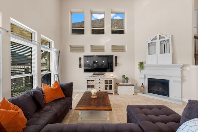 tiled living room with a towering ceiling