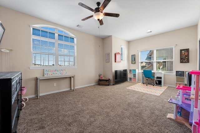 rec room with carpet floors and ceiling fan